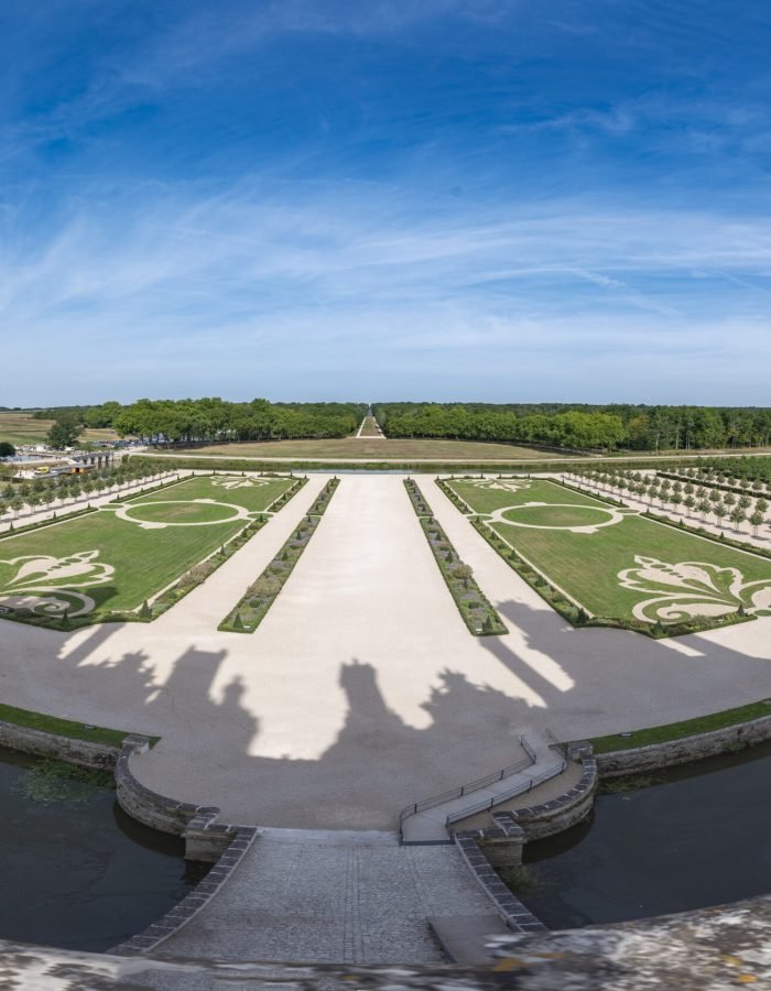 Panoramic from a balcony of the castle of Chambord where you can see its well-kept gardens and the surrounding water pit.